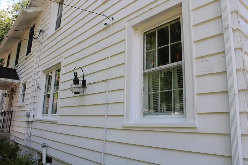 Pressure washing siding